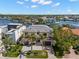 Aerial view of luxury home with lush landscaping and three car garage in waterfront community at 5142 W San Jose St, Tampa, FL 33629