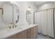 Bright bathroom with double sinks, gold fixtures, and a window for natural lighting at 5142 W San Jose St, Tampa, FL 33629