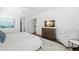 Bright bedroom with natural light, neutral tones, and hardwood flooring at 5142 W San Jose St, Tampa, FL 33629