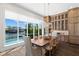 Dining area showcasing a water view, built-in cabinets, and elegant chandelier at 5142 W San Jose St, Tampa, FL 33629