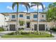 Elegant two-story home featuring a manicured lawn, two-car garage and a beautiful exterior with a symmetrical design at 5142 W San Jose St, Tampa, FL 33629