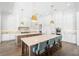 Spacious, bright kitchen with an eat in island, marble countertops, stainless steel appliances and ample storage at 5142 W San Jose St, Tampa, FL 33629