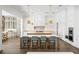 Stylish kitchen with custom white cabinetry, marble countertops, a large island and modern pendant lighting at 5142 W San Jose St, Tampa, FL 33629