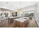 Open concept kitchen featuring a large island, bar seating, and seamless connection to the adjacent living room at 5142 W San Jose St, Tampa, FL 33629