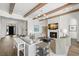 Comfortable living room with fireplace, wood beams, neutral tones, and an open floor plan at 5142 W San Jose St, Tampa, FL 33629