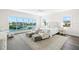 Bright main bedroom featuring waterfront views and a sitting area at 5142 W San Jose St, Tampa, FL 33629