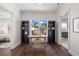 Bright home office with hardwood floors, built-in bookshelves, and a window view at 5142 W San Jose St, Tampa, FL 33629