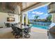 Outdoor kitchen featuring a large table, a grill, and a view of the intercoastal waterway at 5142 W San Jose St, Tampa, FL 33629
