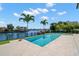 Inviting pool with canal views, surrounded by a spacious deck, perfect for relaxing or entertaining guests outdoors at 5142 W San Jose St, Tampa, FL 33629