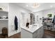 Organized walk-in closet featuring custom shelves, drawers, and island with marble countertop at 5142 W San Jose St, Tampa, FL 33629