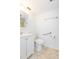 Bright bathroom featuring a white vanity, mirror, and fixtures, providing a clean and functional space at 5421 Orange Blossom N Rd, Pinellas Park, FL 33782