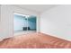 Bedroom featuring carpet and sliding glass doors with a view of the outside patio at 5421 Orange Blossom N Rd, Pinellas Park, FL 33782