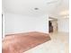 Bright living room with combination of tile and carpeted flooring and recessed lighting at 5421 Orange Blossom N Rd, Pinellas Park, FL 33782