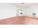 Living room featuring carpet, fan and views into other rooms at 5421 Orange Blossom N Rd, Pinellas Park, FL 33782