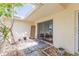 Cozy covered patio area with stone pavers and easy access to the interior living space at 5421 Orange Blossom N Rd, Pinellas Park, FL 33782