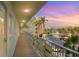 Exterior view of a lengthy balcony overlooking the property's parking lot at 5575 Gulf Blvd # 329, St Pete Beach, FL 33706