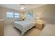 Bedroom featuring neutral walls, carpet, ceiling fan and furnishings at 5575 Gulf Blvd # 329, St Pete Beach, FL 33706