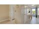 Neutral hallway featuring an updated kitchen, and tile floors at 5575 Gulf Blvd # 329, St Pete Beach, FL 33706