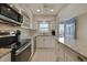 Updated kitchen featuring white cabinets, granite countertops and stainless steel appliances at 5575 Gulf Blvd # 329, St Pete Beach, FL 33706