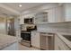 Updated kitchen featuring white cabinets, granite countertops and stainless steel appliances at 5575 Gulf Blvd # 329, St Pete Beach, FL 33706