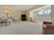 Bright living room with neutral tones and ample seating, creating a comfortable and inviting atmosphere at 5575 Gulf Blvd # 329, St Pete Beach, FL 33706