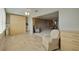 Comfortable living space with tile floors, Murphy bed, and a relaxing atmosphere, perfect for unwinding at 5575 Gulf Blvd # 329, St Pete Beach, FL 33706