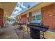 An outdoor grill area with picnic tables and bbq grills, perfect for gatherings at 5575 Gulf Blvd # 329, St Pete Beach, FL 33706