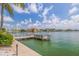 Scenic waterfront view from dock with seating, showcasing the beautiful surrounding neighborhood at 5575 Gulf Blvd # 329, St Pete Beach, FL 33706