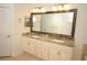 Bathroom featuring double sinks, granite countertops, and modern fixtures at 6417 Blue Sail Ln, Apollo Beach, FL 33572
