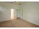 Bedroom with neutral carpet and connecting doorways to other rooms at 6417 Blue Sail Ln, Apollo Beach, FL 33572