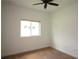 Bedroom with neutral carpet, white walls, one window, and a ceiling fan at 6417 Blue Sail Ln, Apollo Beach, FL 33572