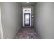 Stylish entryway with decorative front door and textured walls at 6417 Blue Sail Ln, Apollo Beach, FL 33572