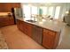 Bright kitchen with granite countertops, stainless steel appliances, and a large center island at 6417 Blue Sail Ln, Apollo Beach, FL 33572
