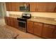Well-appointed kitchen with granite countertops, stainless steel appliances, and ample cabinet space at 6417 Blue Sail Ln, Apollo Beach, FL 33572