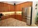 Modern kitchen featuring stainless steel refrigerator and ample cabinet space at 6417 Blue Sail Ln, Apollo Beach, FL 33572