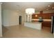 Kitchen seamlessly integrates with dining area, showcasing an island, and stainless steel appliances at 6417 Blue Sail Ln, Apollo Beach, FL 33572
