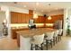 Spacious kitchen with granite countertops, stainless steel appliances, and a large center island at 6417 Blue Sail Ln, Apollo Beach, FL 33572