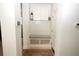 Clean mud room featuring a built-in bench with storage and coat hooks at 6417 Blue Sail Ln, Apollo Beach, FL 33572