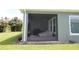 Cozy screened patio, ideal for relaxing outdoors and enjoying the view at 6417 Blue Sail Ln, Apollo Beach, FL 33572