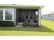 Inviting screened patio with seating, perfect for outdoor entertaining and relaxation at 6417 Blue Sail Ln, Apollo Beach, FL 33572