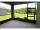Enjoy this screened-in patio with green backyard views, perfect for outdoor relaxation and entertainment at 6417 Blue Sail Ln, Apollo Beach, FL 33572