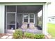 Comfortable screened-in patio area for enjoying the outdoors at 6417 Blue Sail Ln, Apollo Beach, FL 33572