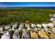 A neighborhood overview with the house marked by a pin, showcasing a green landscape and scenic views at 716 Manns Harbor Dr, Apollo Beach, FL 33572