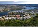 An aerial view of a waterfront community highlighting homes along a scenic lake with private boat docks at 716 Manns Harbor Dr, Apollo Beach, FL 33572