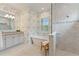 Luxurious bathroom showcasing a soaking tub, glass-enclosed shower, and granite vanity at 716 Manns Harbor Dr, Apollo Beach, FL 33572