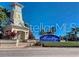 Community entrance showcasing a decorative clock tower and 'Mira Bay' sign, with manicured landscaping at 716 Manns Harbor Dr, Apollo Beach, FL 33572