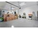 This clean garage offers ample space, painted floors and ceiling with storage at 716 Manns Harbor Dr, Apollo Beach, FL 33572