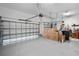 This spacious garage is clean with painted floors and features a garage door opener at 716 Manns Harbor Dr, Apollo Beach, FL 33572