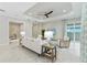 Spacious living area showcasing tile flooring, neutral decor, sliders to the lanai and access to other living areas at 716 Manns Harbor Dr, Apollo Beach, FL 33572