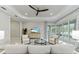 Bright living area with tile flooring, a ceiling fan, and sliding glass doors leading to the outdoor space at 716 Manns Harbor Dr, Apollo Beach, FL 33572